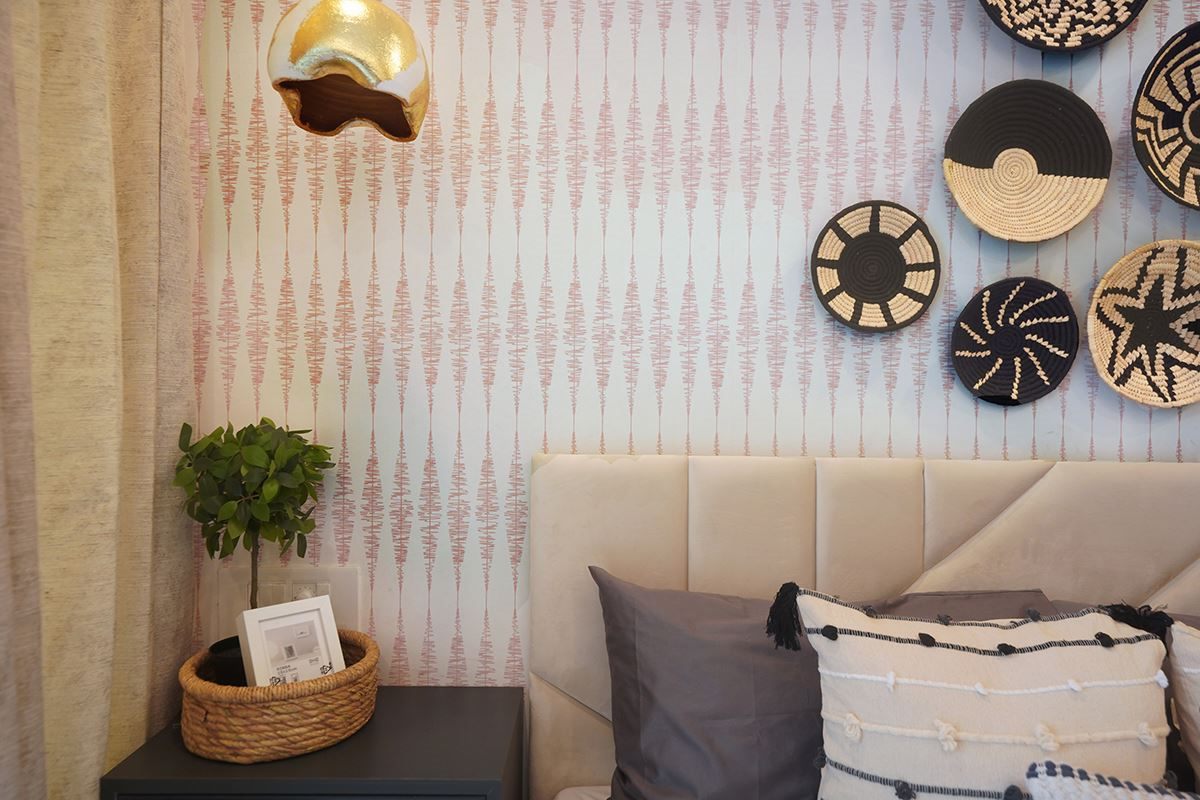 Pink unicorn wallpaper with lavender panel wainscoting in kids room